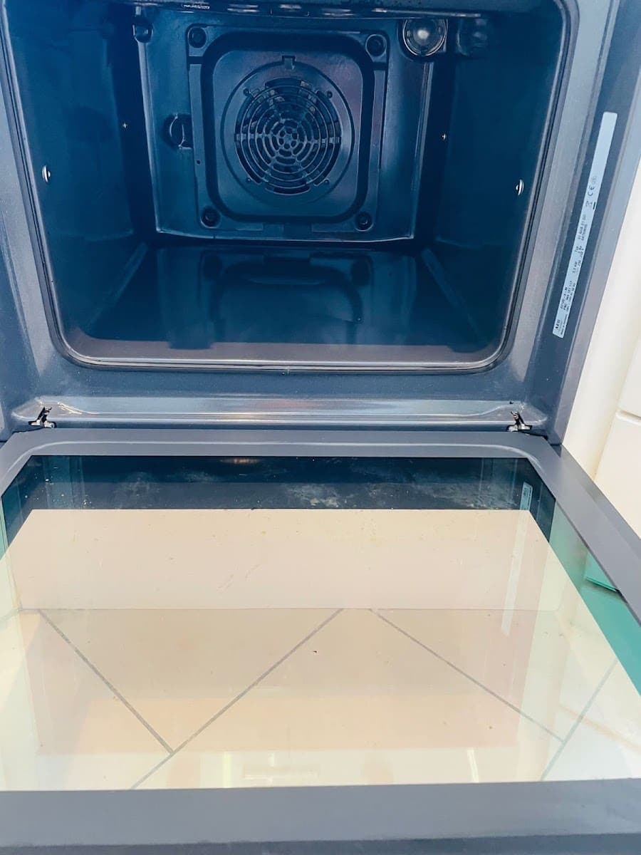 The same oven after cleaning, interior and door glass spotless